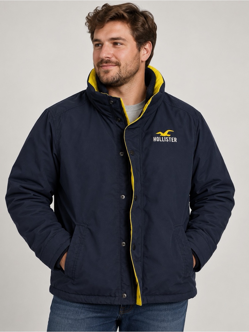 Hollister Men's Navy Puffer Jacket with Yellow Accents